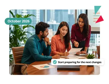Three colleagues reviewing documents in a meeting – start preparing for October 2026 Employment Rights Act changes