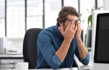 Man frustrated due the disadvantages of the company's old HR Software