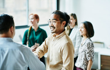 Colleagues greeting each other