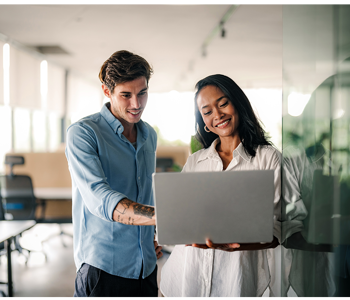 Employees reviewing on-target earnings on laptop
