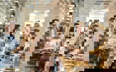 Team discussing plans during coffee