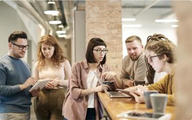 Team discussing plans during coffee