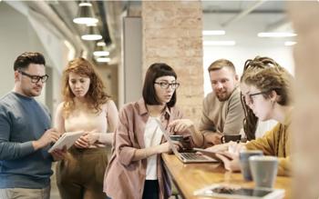 Team discussing plans during coffee