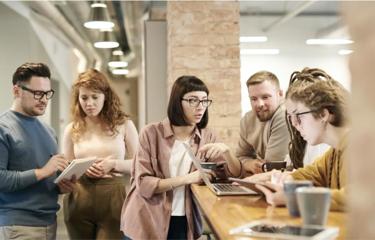 Team discussing plans during coffee