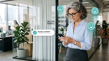 Employee checking a payslip available notification on her phone using payroll self-service software