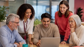 Employees of all ages working on a project