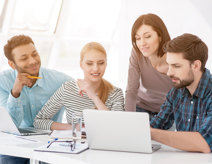 Team Looking At HR Software