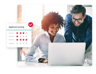 Two HR professionals reviewing the applicant scoring feature on PeopleHR’s recruitment management software.