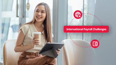 Woman holding a tablet with the caption "international payroll challenges"