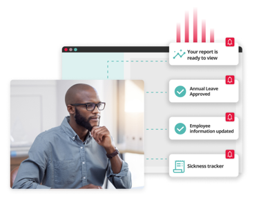 Man looking at a computer screen with illustrated HR notifications for key decisions