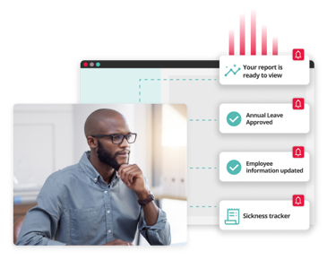 Man looking at a computer screen with illustrated HR notifications for key decisions