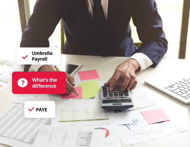 Person working at a desk with documents and calculator, illustrating the difference between umbrella payroll and PAYE.