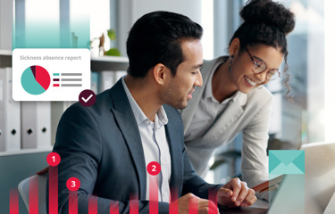 Man and women collaborating around a computer