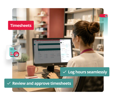Employee at a desk with shelves behind her, working on a computer showing a timesheet table