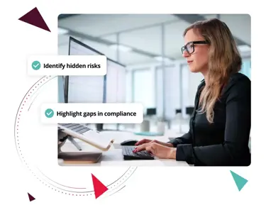 Woman working on laptop with text boxes saying "identify hidden risks" and "highlight gaps in compliance"