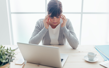 Stressed Person Looking At Laptop