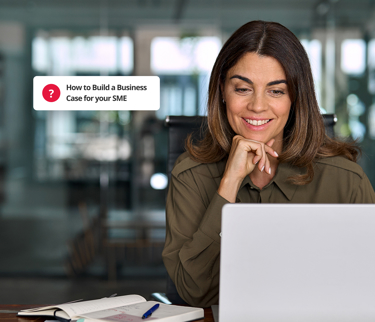 Woman working on laptop , with text saying: How to build a business case for your SME.