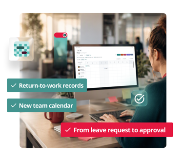 Employee at a desk working on a monitor showing a team calendar in PeopleHR HR software
