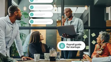 team discussing payroll for startups