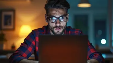 Anxious-looking man at a computer