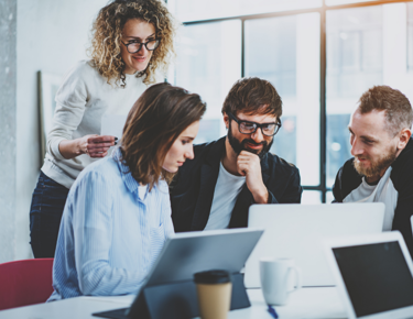 Team Looking At HR Software 4