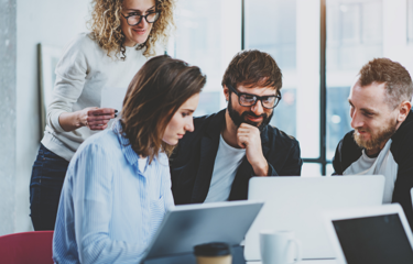 Team Looking At HR Software 4