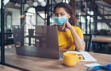 person wearing face mask in the office