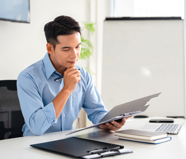 man analysing hidden costs of hr software 