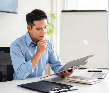 man analysing hidden costs of hr software 